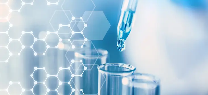 Pipette dropping liquid into test tube with molecular pattern overlay