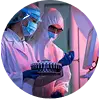 Scientists in protective clothing analysing test samples in a laboratory with advanced equipment